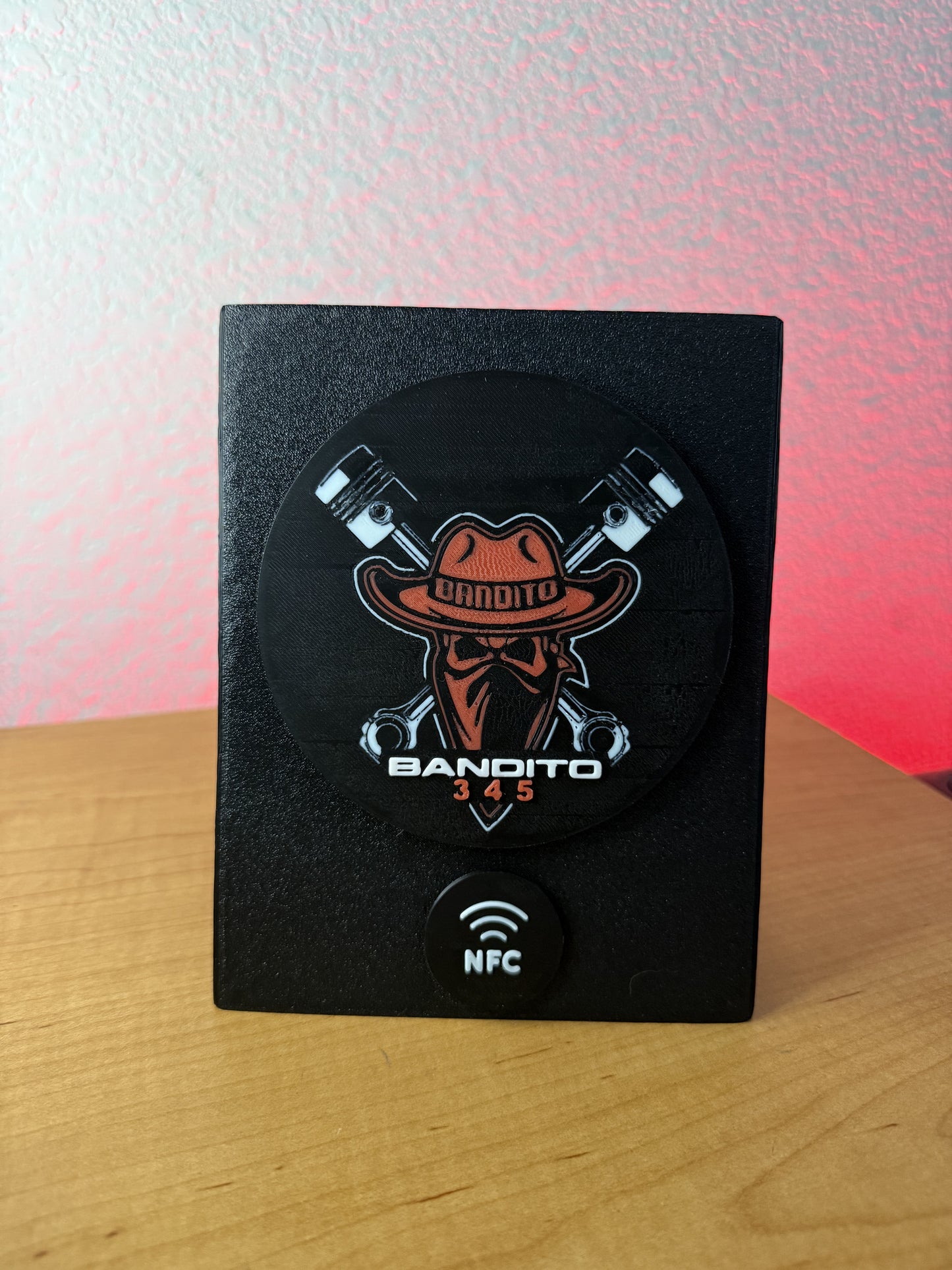Black device with 'Bandito 345' logo on a wooden surface
